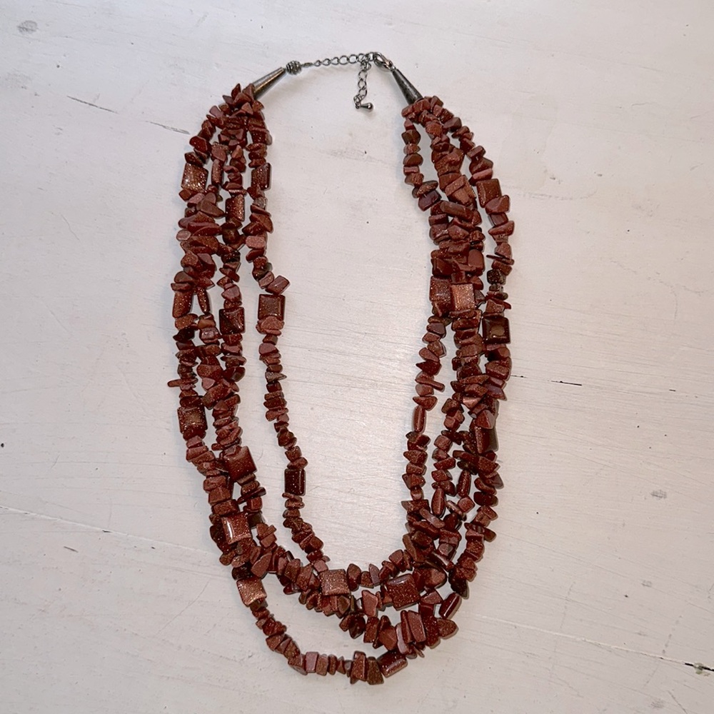 Gently loved brown shimmery handmade 4 strand beaded necklace.